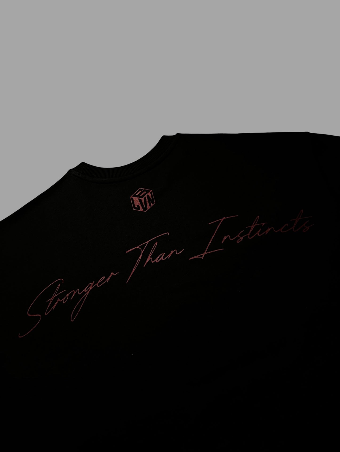 STRONGER THAN INSTINCTS OVERSIZED T-SHIRT (BLACK)